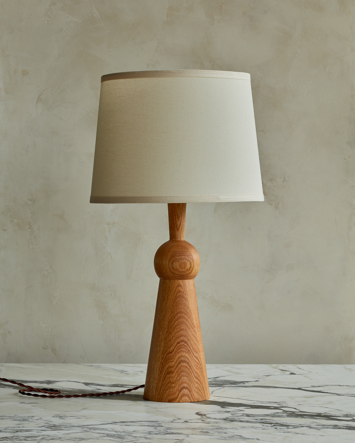 Natural red oak solid wood table lamp with gently tapered body and ivory linen shade #wood-finish_natural red oak #shade-color_ivory linen