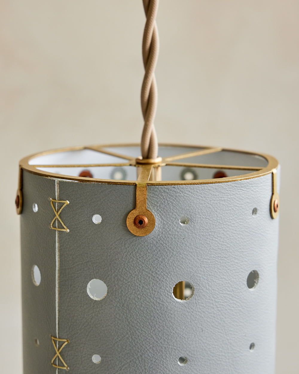 Charming leather pendant light with blue handstitched shade and brass accents  #color_cloud blue