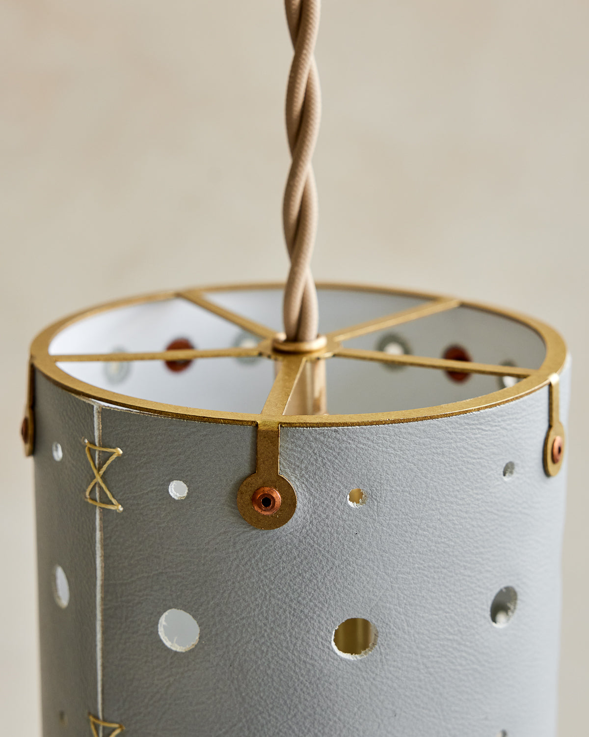 Charming leather pendant light with blue handstitched shade and brass accents  #color_cloud blue