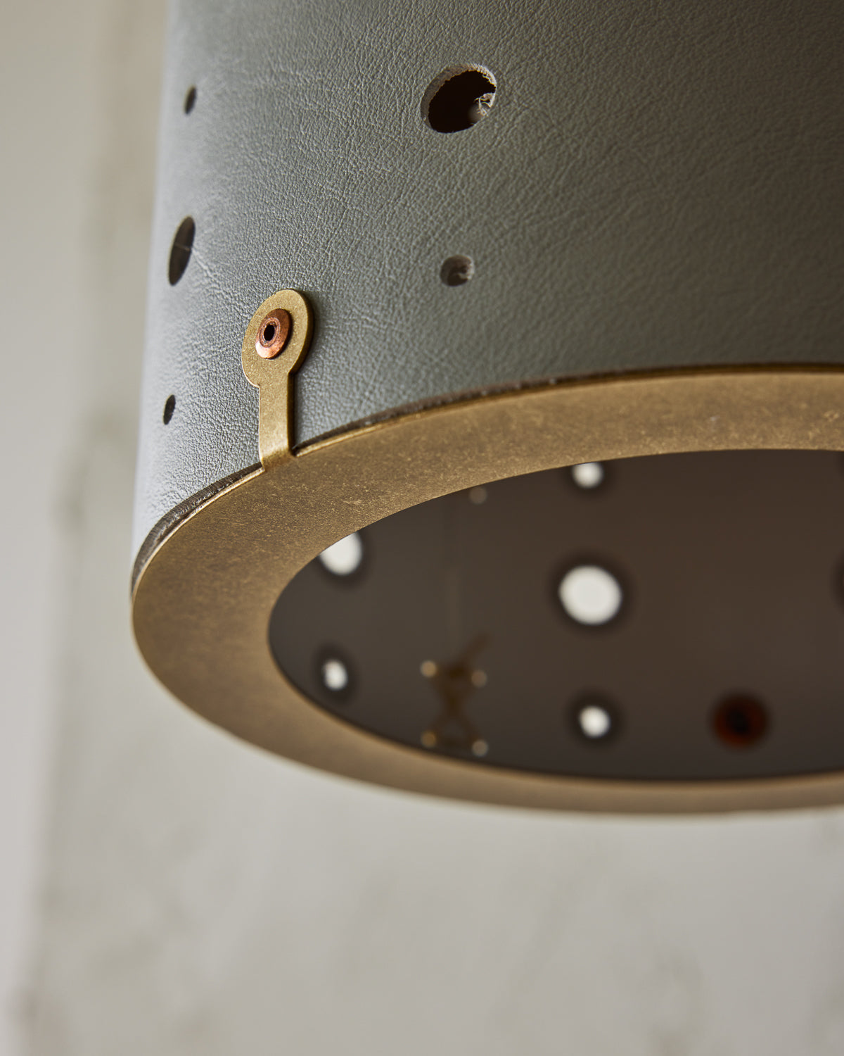 Articulating satin brass sconce with blue handstitched shade and walnut backplate #leather-finish_cloud blue