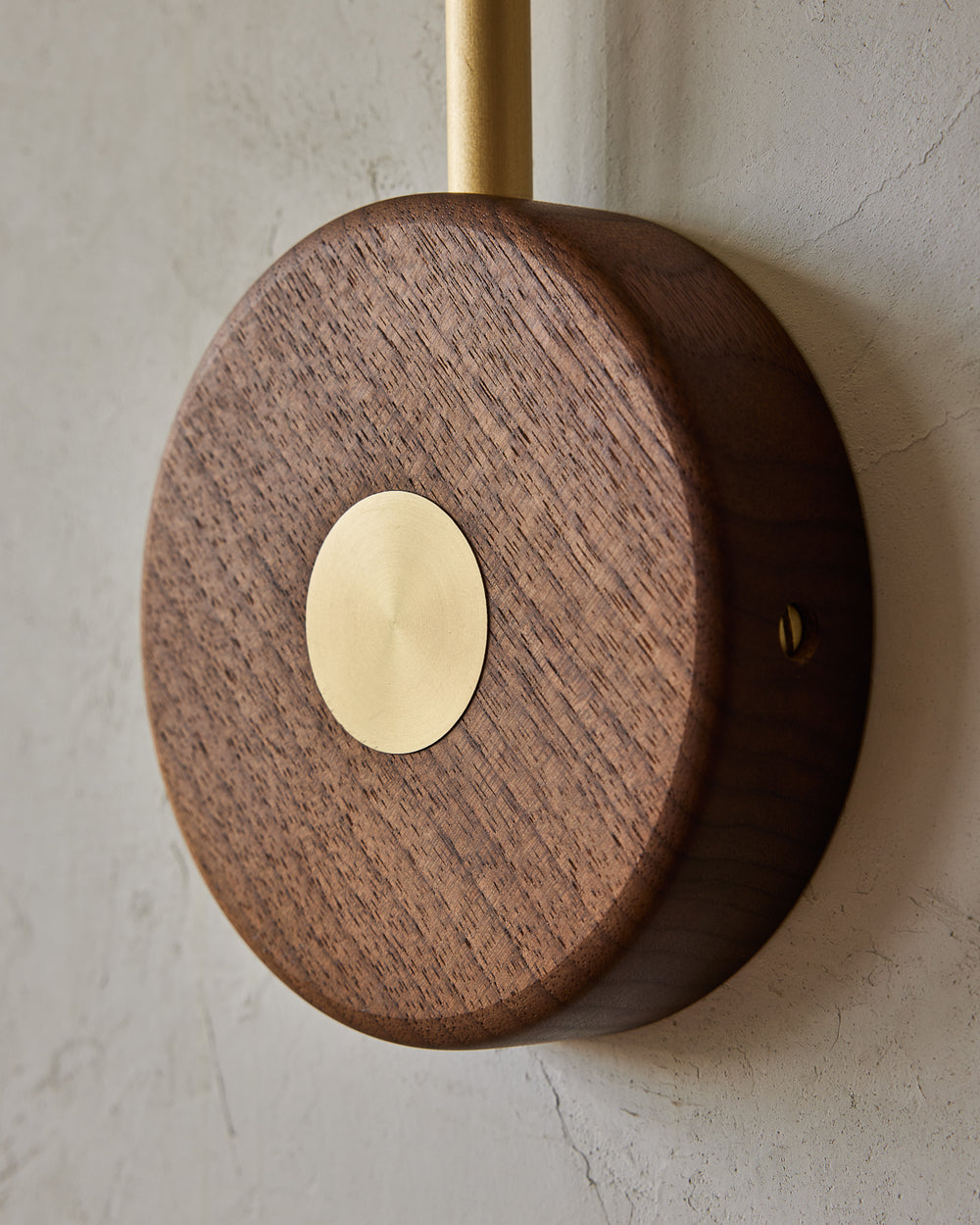 Articulating satin brass sconce with blue handstitched leather shade and walnut backplate #wiring_hardwired
