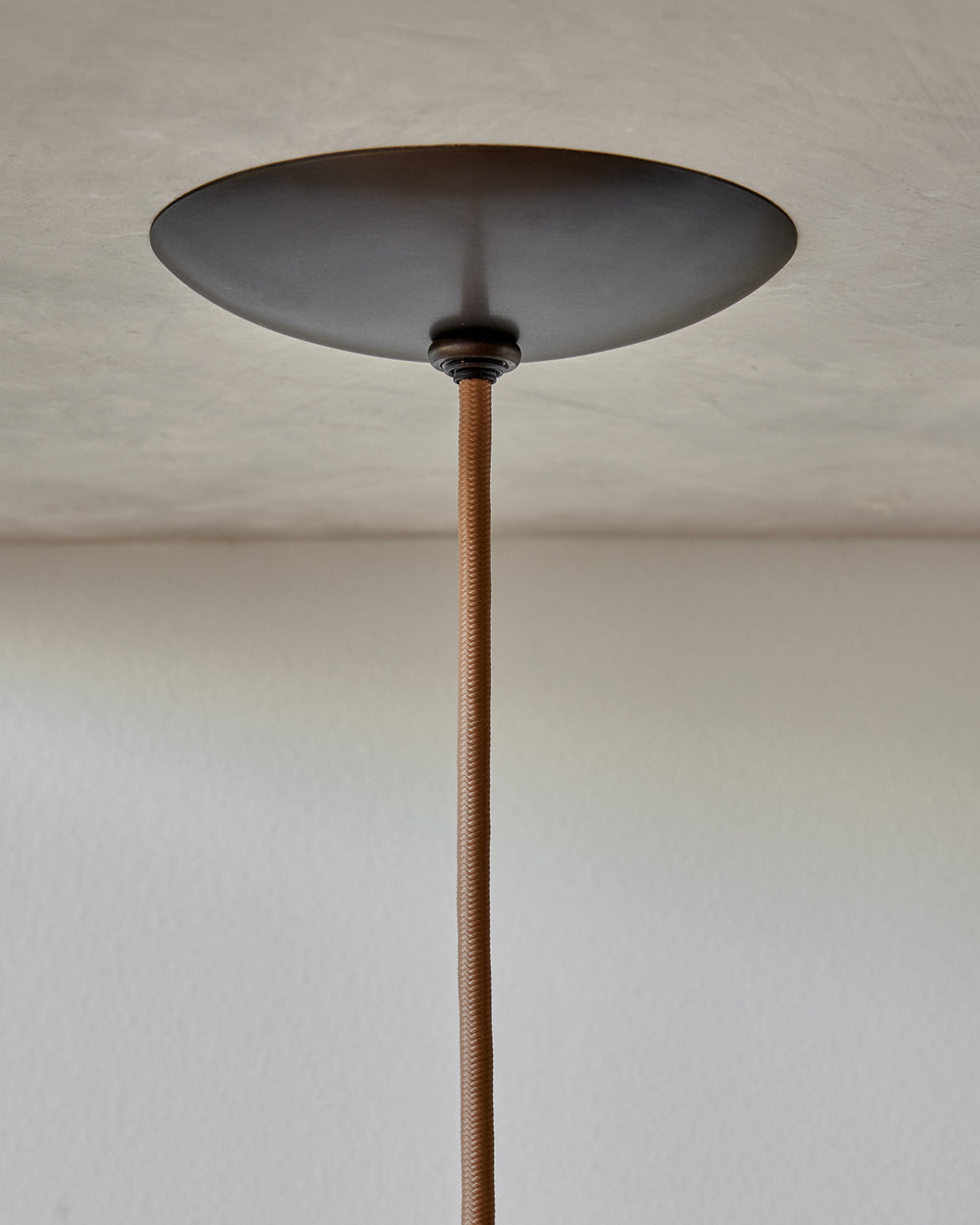 Modern black globe pendant light with dark oil rubbed brass curved body and white milk glass globe #metal-finish_oil rubbed brass