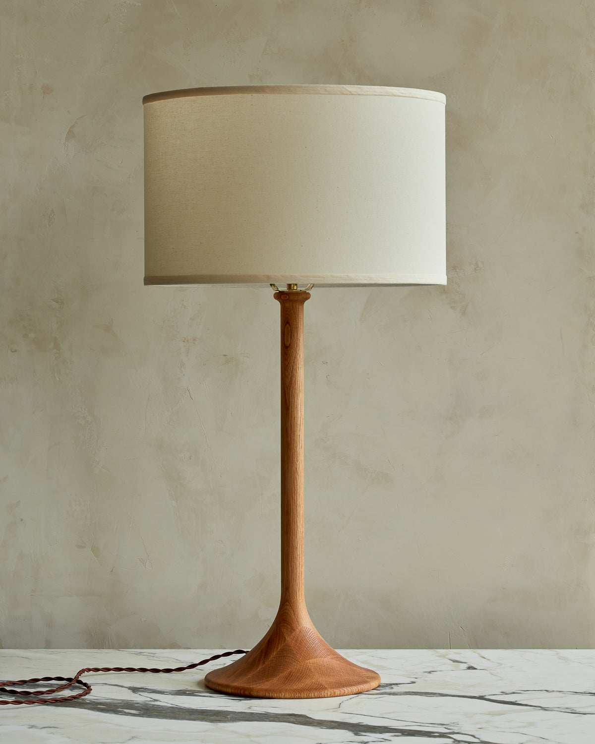 Large Trumpet table lamp with natural finish and ivory drum shade
#wood-finish_natural red oak #shade-color_ivory linen