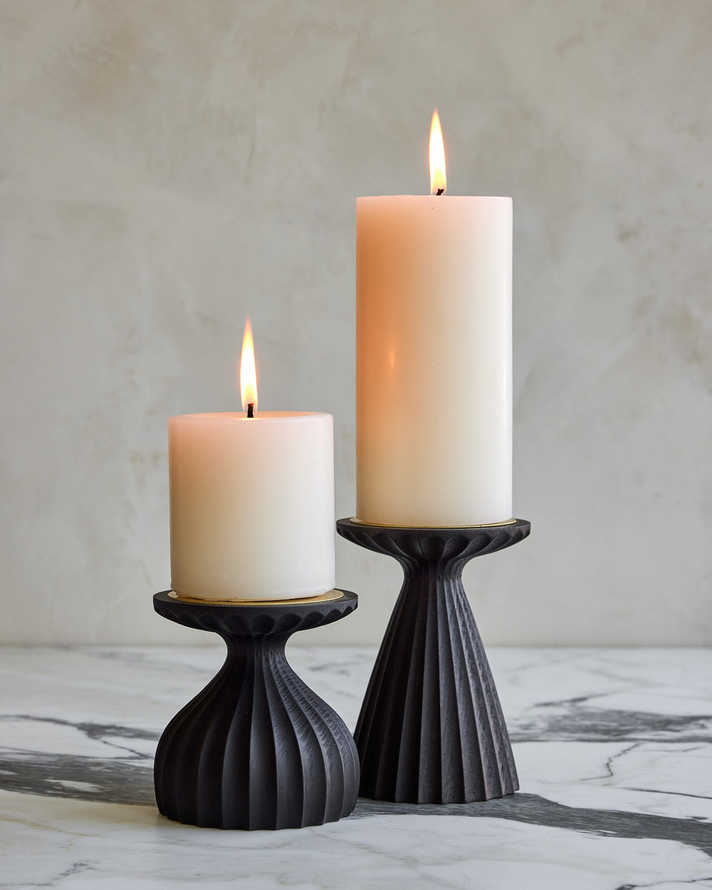 Pair of delicately grooved pillar candle holders in dark wash maple wood with shell white pillar candles #wood-finish_dark wash maple