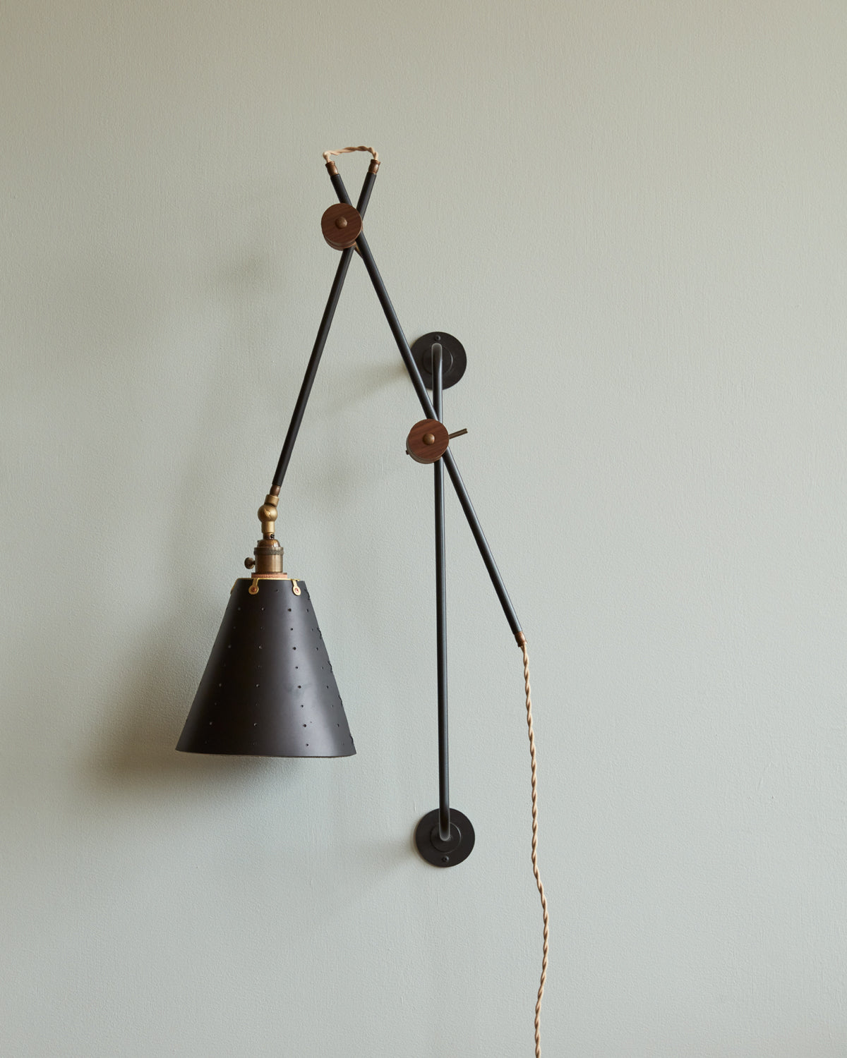 Large articulating black plug in wall sconce with black handstitched cone leather shade #shade-finish_black harness #wiring_plug-in